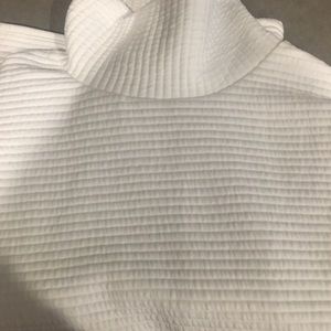 Sequin pants and white sweater outfit.